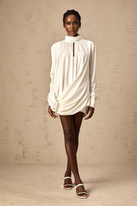 A white mini dress with ruched details and faux flower embellishments named Maeva