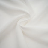 A white mini dress with ruched fabric and ribbon design details featuring a short length and fitted silhouette