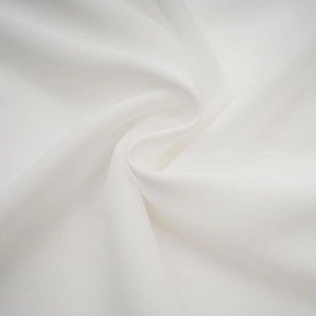A white mini dress with ruched fabric and ribbon design details featuring a short length and fitted silhouette