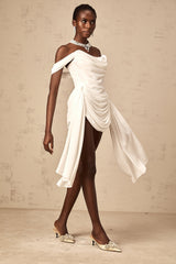 A white mini dress with ruched fabric featuring ribbon design details and a short hemline