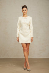 A white mini dress with sequin embellishments made from tweed fabric featuring a classic Angelique design