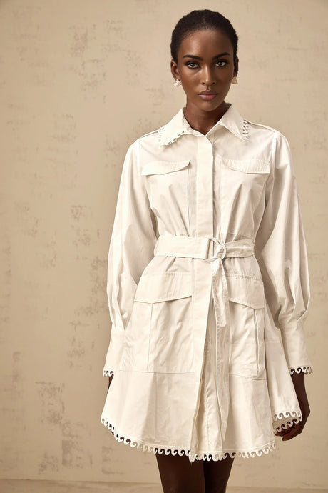 A white mini shirt dress with a belted waist featuring short sleeves and a collar named Clemence
