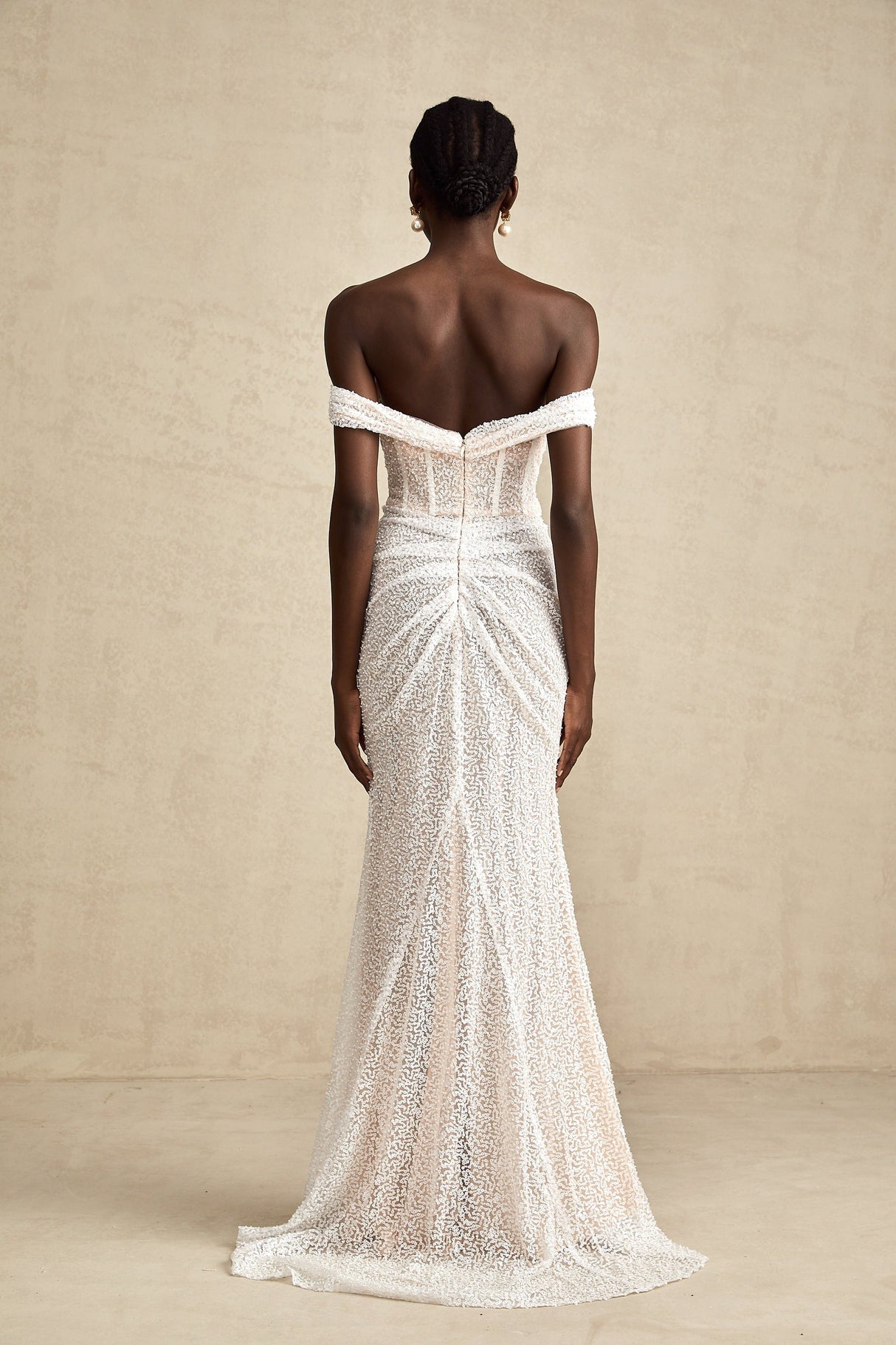 A white offshoulder maxi dress with embellishments named Margot