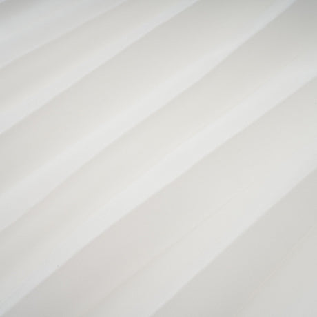 A white offshoulder maxi dress with pleated details and a flowing silhouette worn by a model named Vanessa