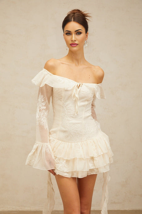 A white offshoulder mini dress with embroidered details named Desiree