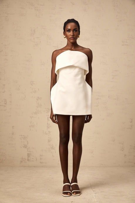 A white offshoulder mini dress with puff sleeves named Enora on a model or mannequin