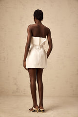 A white offshoulder mini dress with puff sleeves named Enora