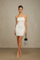 A white offshoulder mini dress with sequin embellishments on a female model
