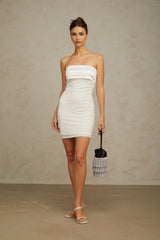 A white offshoulder mini dress with sequin embellishments worn by a model against a plain background