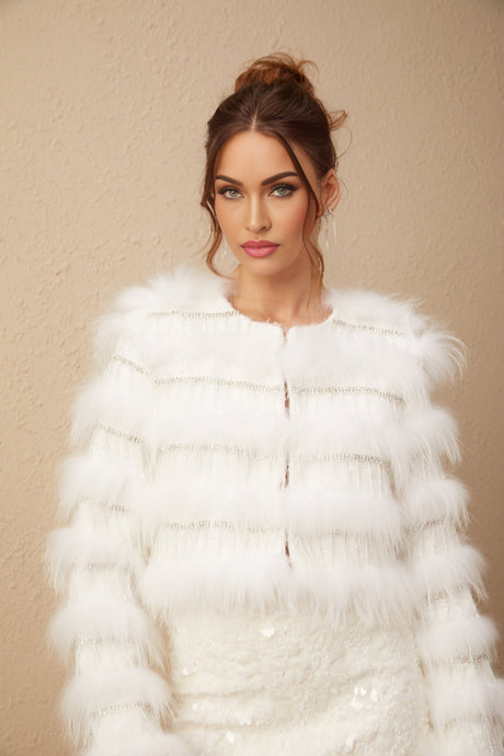 A white padded fur jacket adorned with crystal embellishments in a floral pattern featuring a Margherita design