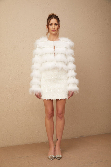 A white padded fur jacket adorned with crystal embellishments in a Margherita floral pattern