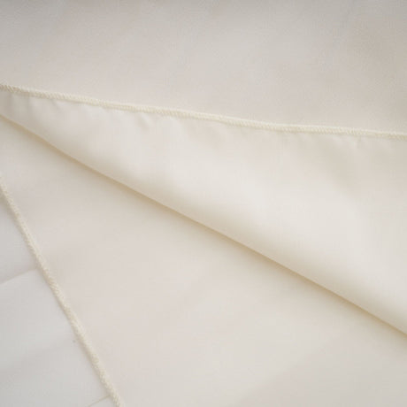 A white pleated jacket and matching dress set with embellishments The jacket features a tailored design while the dress has a sleek silhouette Both pieces are adorned with decorative details creating an elegant ensemble suitable for formal occasions