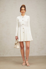 A white pleated knit mini dress with a fitted silhouette and short sleeves named Emeline