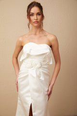 A white satin maxi dress with floral applique details named Anna