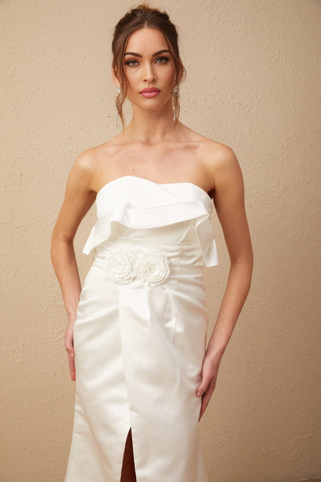 A white satin maxi dress with floral applique details named Anna