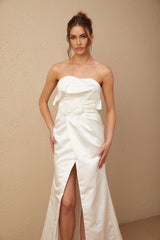 A white satin maxi dress with floral applique details named Anna