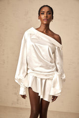 A white satin mini dress with a deconstructed design featuring asymmetrical elements and irregular seams named Xenia
