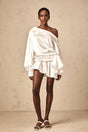 A white satin mini dress with deconstructed design elements named Xenia