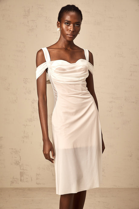 A white semi sheer midi dress with ruched detailing named Gloria