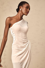 A white semi sheer midi dress with ruched detailing named Ophélie worn by a model standing against a plain background