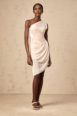 A white semi sheer midi dress with ruched detailing named Ophelie worn by a model standing against a plain background