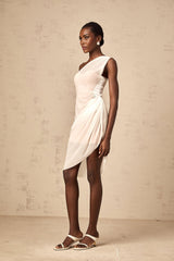 A white semi sheer midi dress with ruched detailing named Ophélie