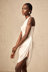 A white semi sheer midi dress with ruched detailing named Ophélie