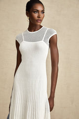 A white semisheer midi dress with scalloped hem and delicate details named Liane