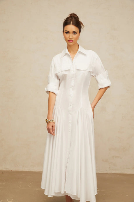 A white shirt dress with a front slit and shirred detailing named Dulcie