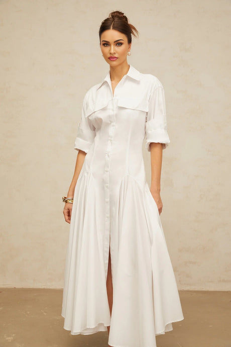A white shirt dress with a front slit and shirred detailing named Dulcie