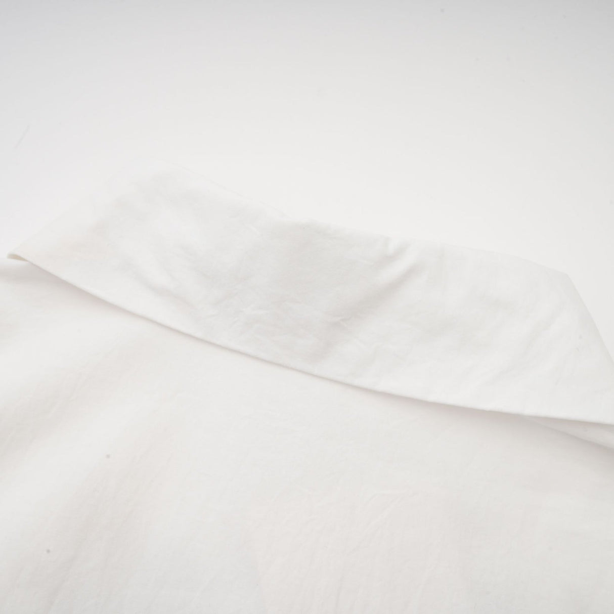 A white shirt with floral cutout patterns and a feminine design named Rosalie