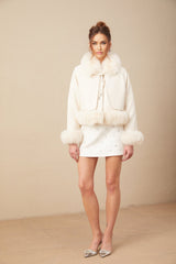 A white short coat made of suede with fur padding and a padded design featuring a collar and front closure