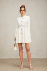 A white short pleated mini dress with a knitted fabric design featuring a fitted bodice and flared skirt