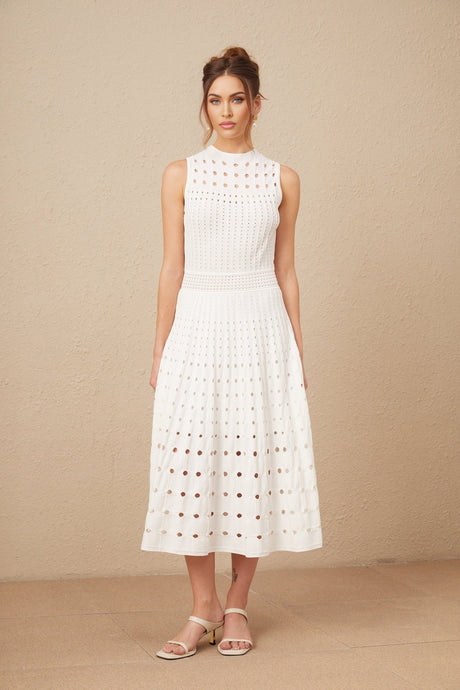 A white sleeveless knitted midi dress with cutout details featuring a fitted silhouette and a high neckline named Charlotte