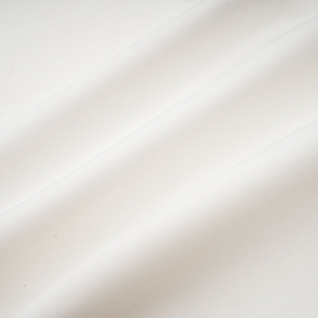 A white sleeveless maxi dress with a bow and artificial flower decoration named Magali