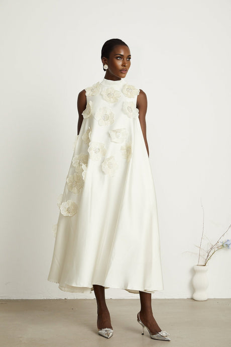 A white sleeveless midi dress with floral applique details named Emilie