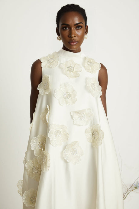 A white sleeveless midi dress with floral applique details named Emilie