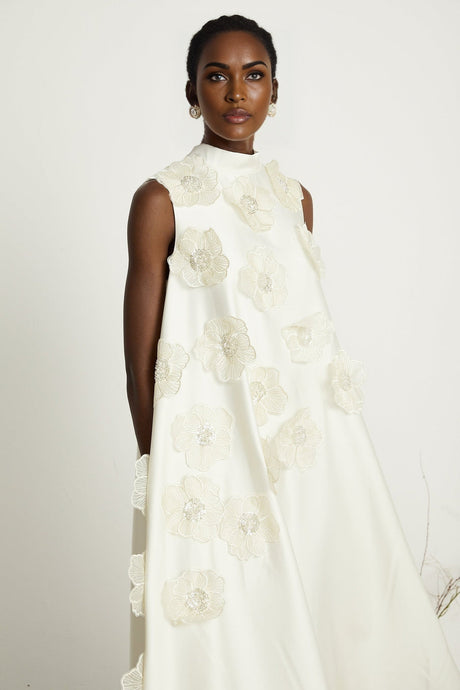 A white sleeveless midi dress with floral applique details named Emilie