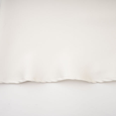 A white sleeveless midi dress with floral appliques called Emilie