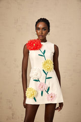A white sleeveless mini dress with 3d floral petal details named Veronique