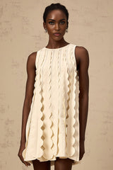 A white sleeveless mini dress with wavy details named Axelle