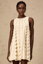 A white sleeveless mini dress with wavy details named Axelle