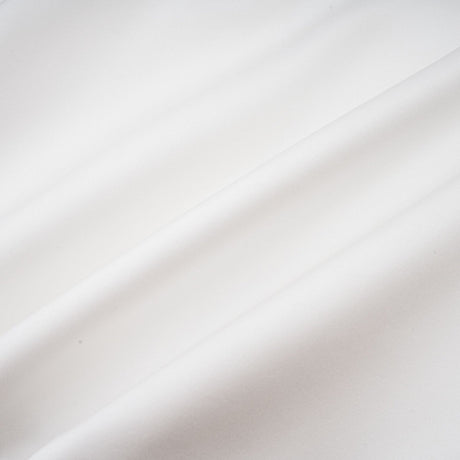 A white strapless mini dress with a corsetstyle bodice adorned with floral petal details named Lucie