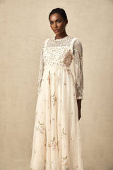 A white tulle midi dress with delicate floral embroidery featuring a Celine design with a fitted bodice and flowing skirt