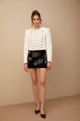 A white tweed jacket adorned with crystal embellishments named Nerina
