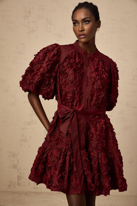 A winered mini dress with 3D petal puff details named Segolene