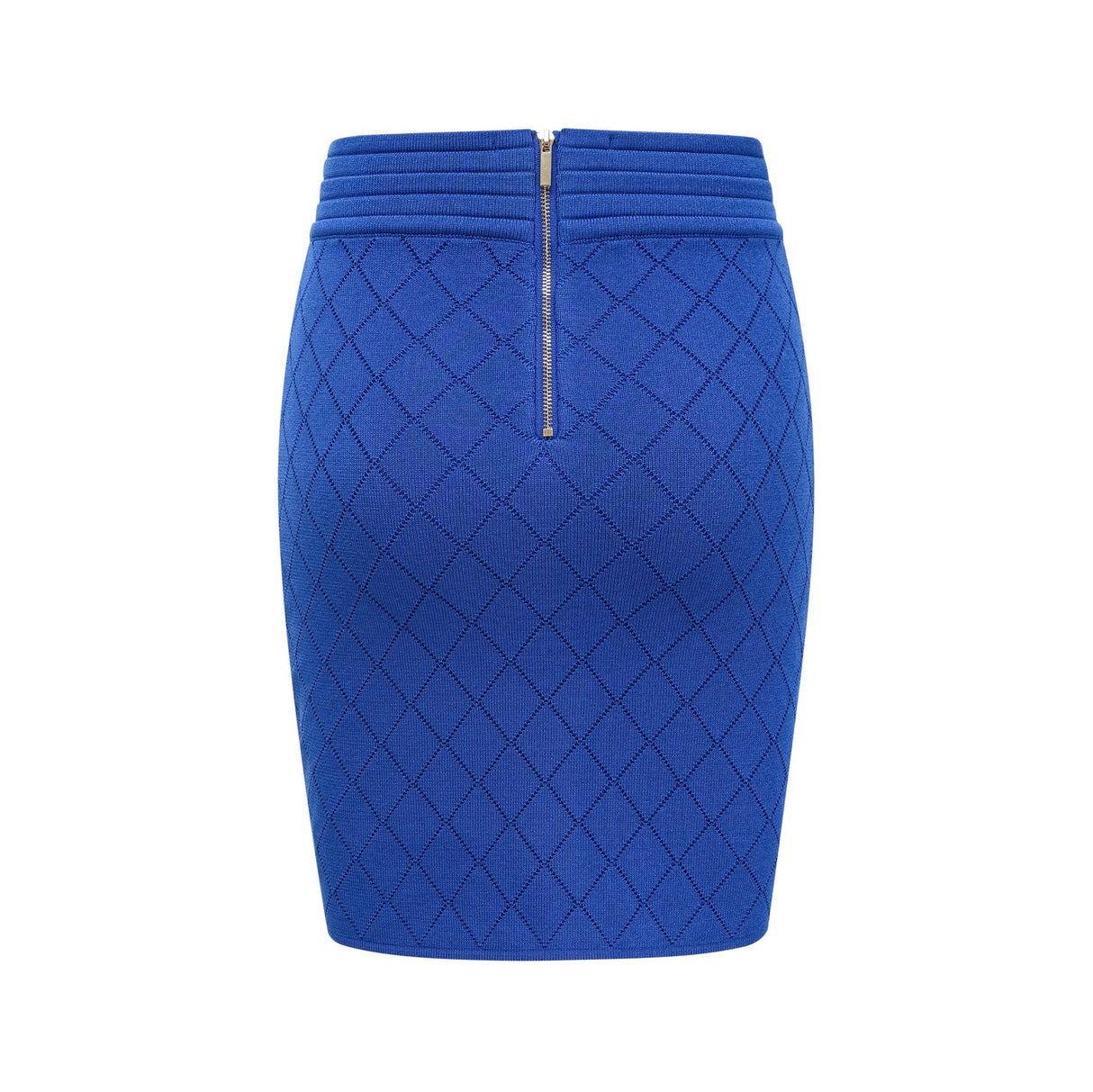 A woman wearing a blue knitted matching set consisting of a top with button details and a skirt