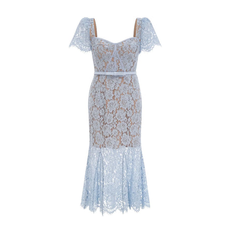 A woman wearing a blue midi dress with floral lace pattern and boned bodice