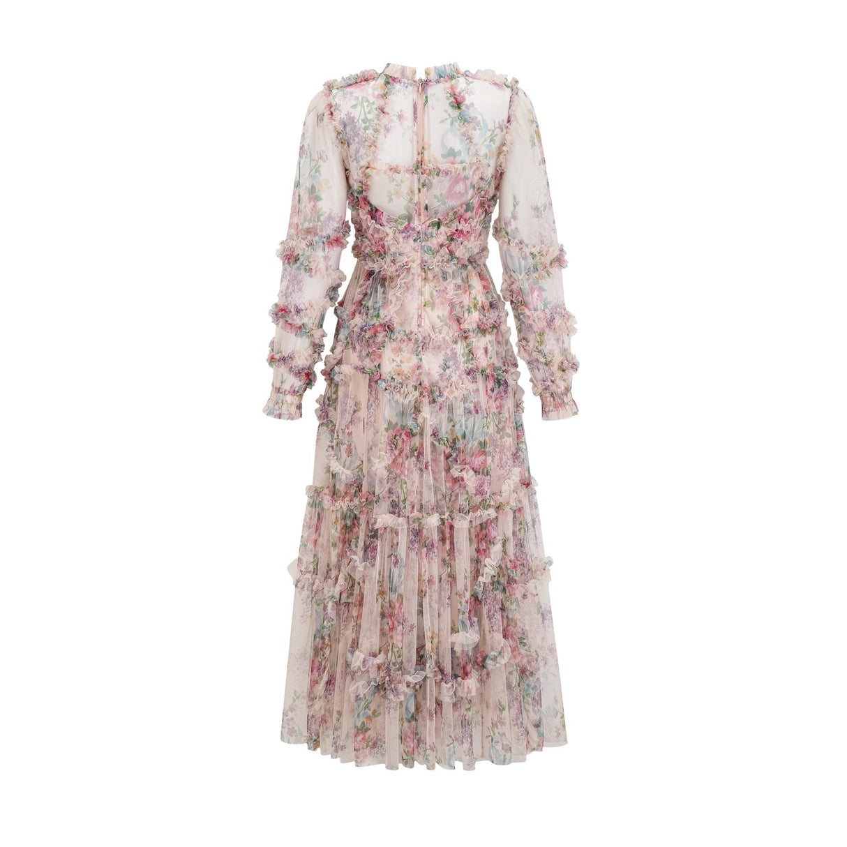 A woman wearing a floral patterned midi dress with ruffled details and a tulle skirt standing in a relaxed pose