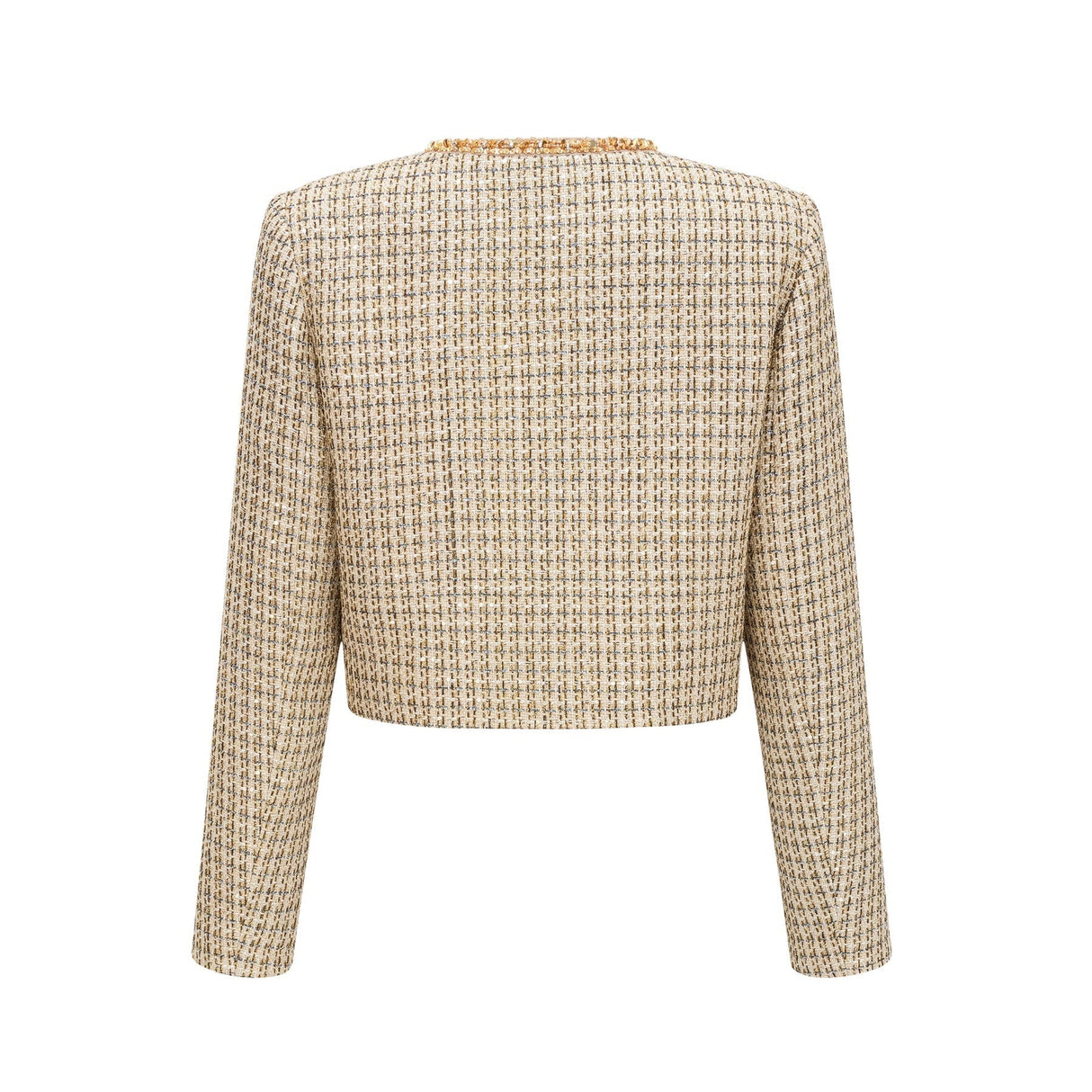 A woman wearing a gold tweed jacket and matching skirt set with sequin embellishments The outfit has a luxurious and sparkly appearance suitable for formal occasions
